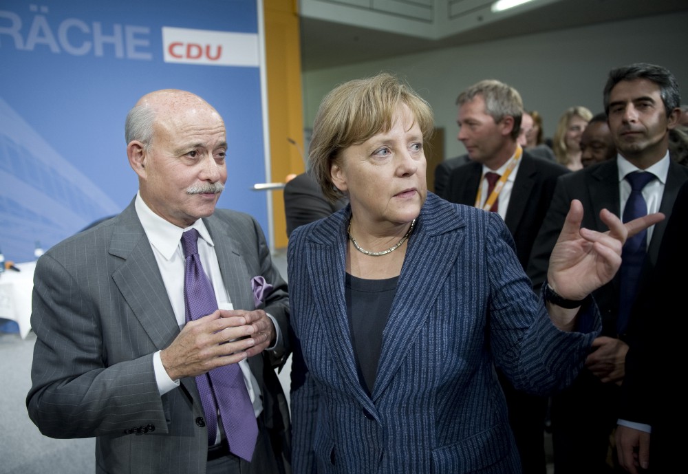 Jeremy Rifkin and Chancellor Angela Merkel at a CDU conference in Berlin, 2011.